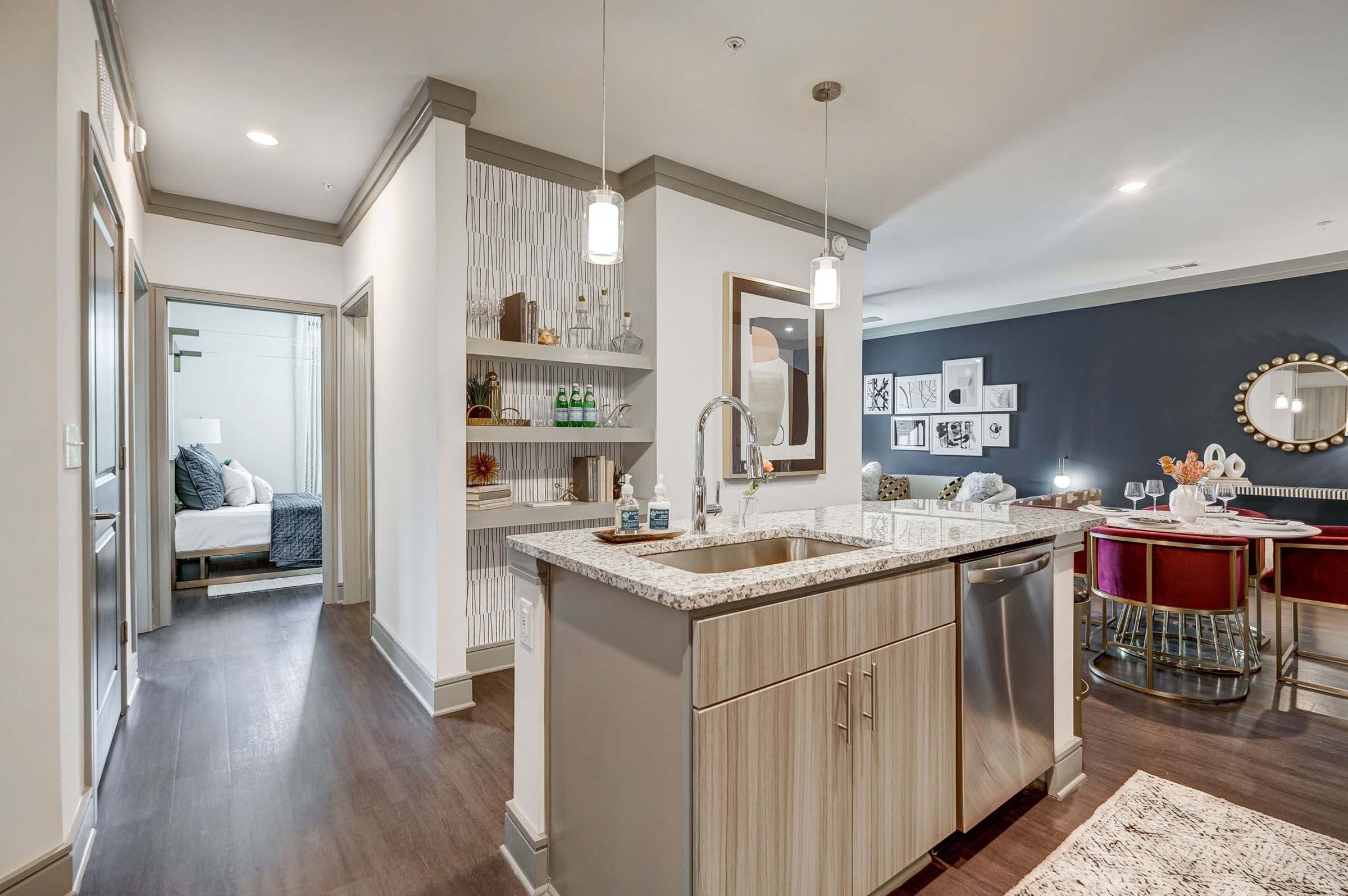 Large kitchen island and built-in shelving at Camden Alpharetta apartments in Alpharetta, GA.