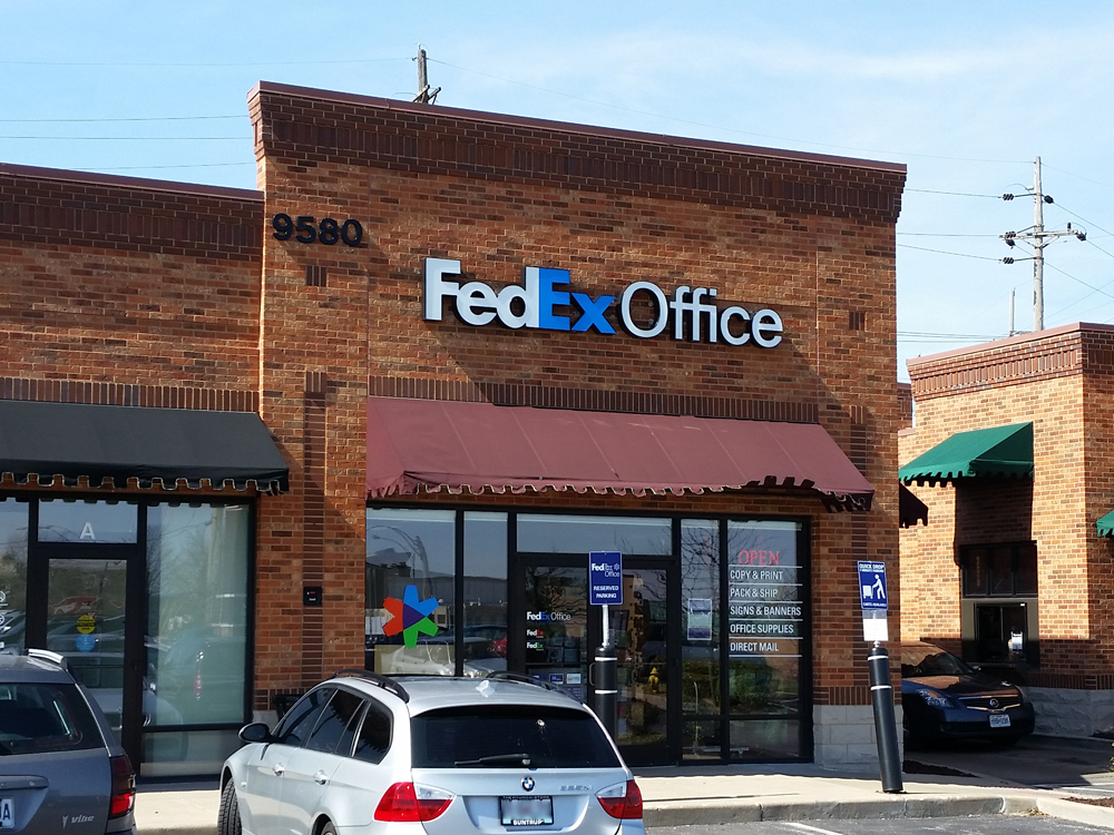 Exterior photo of FedEx Office location at 9580 Watson Rd\t Print quickly and easily in the self-service area at the FedEx Office location 9580 Watson Rd from email, USB, or the cloud\t FedEx Office Print & Go near 9580 Watson Rd\t Shipping boxes and packing services available at FedEx Office 9580 Watson Rd\t Get banners, signs, posters and prints at FedEx Office 9580 Watson Rd\t Full service printing and packing at FedEx Office 9580 Watson Rd\t Drop off FedEx packages near 9580 Watson Rd\t FedEx shipping near 9580 Watson Rd