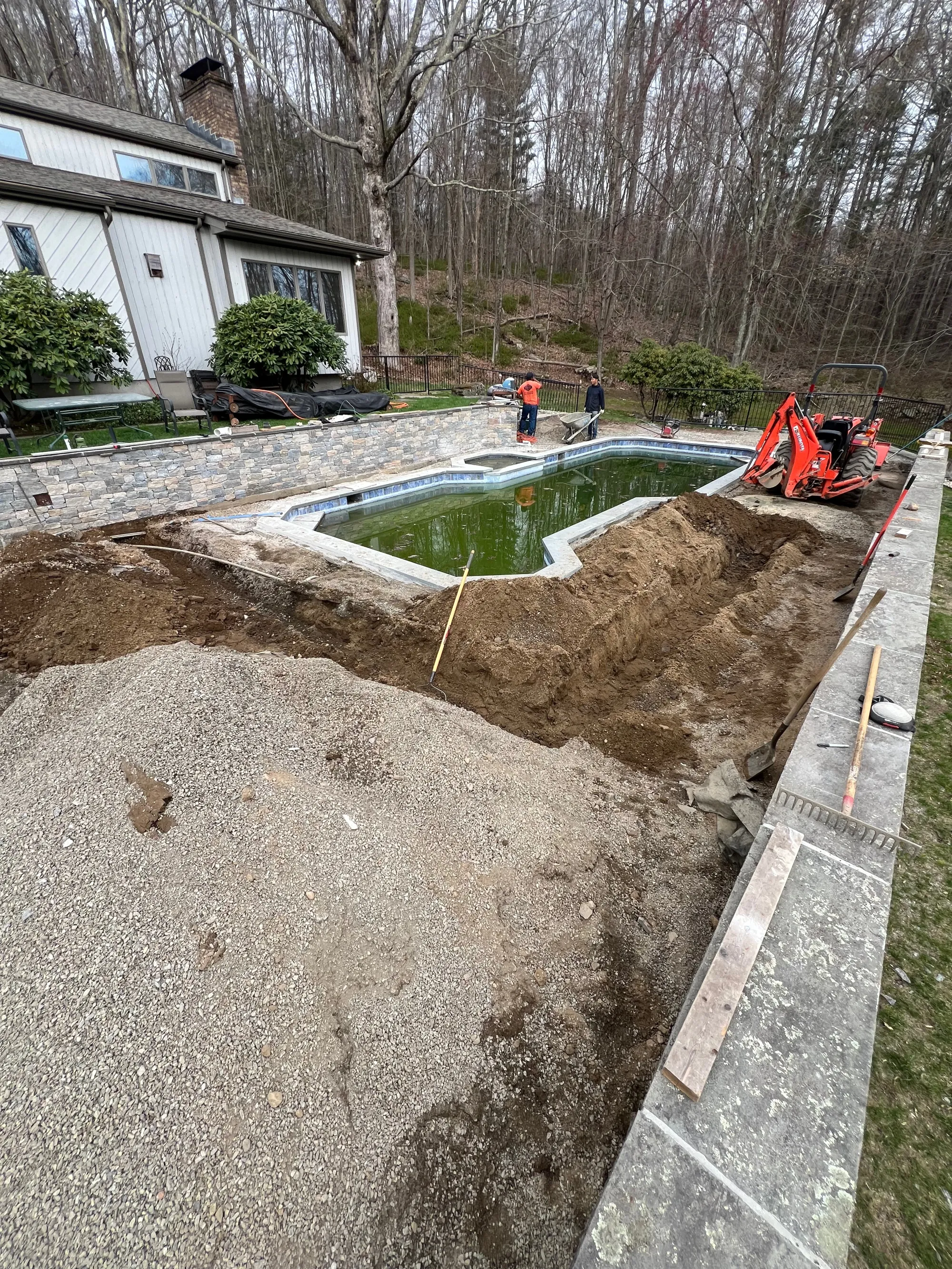 Trench being dug for drainage install - Excavation, Drainage & Site Prep project by General Masonry LLC.