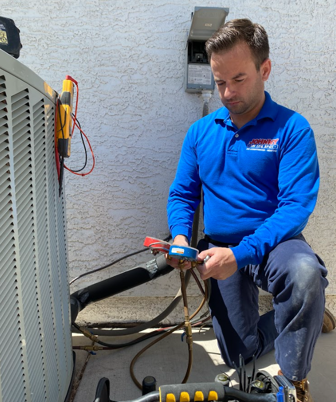 HVAC technician diagnosing air conditioning system outdoors. 