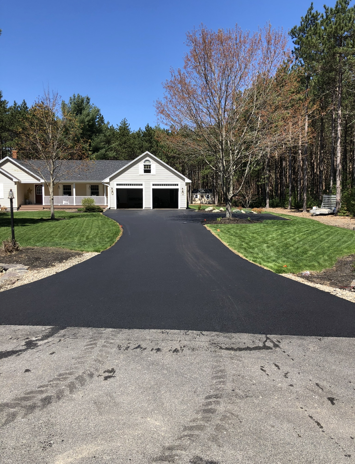 New residential driveway paving, delivering a smooth, durable asphalt surface built to last.