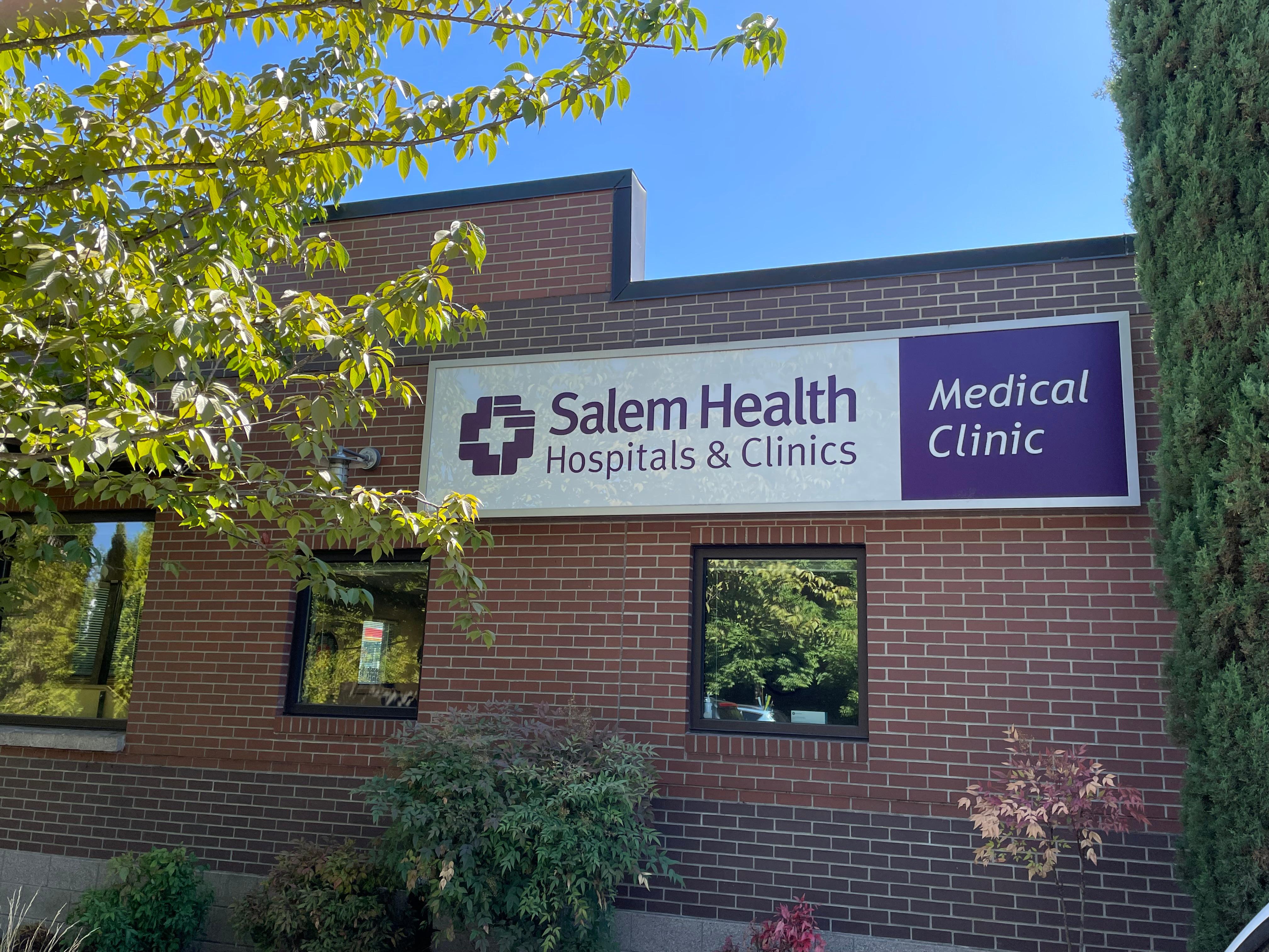 Main building sign of the clinic, visible from the parking lot.