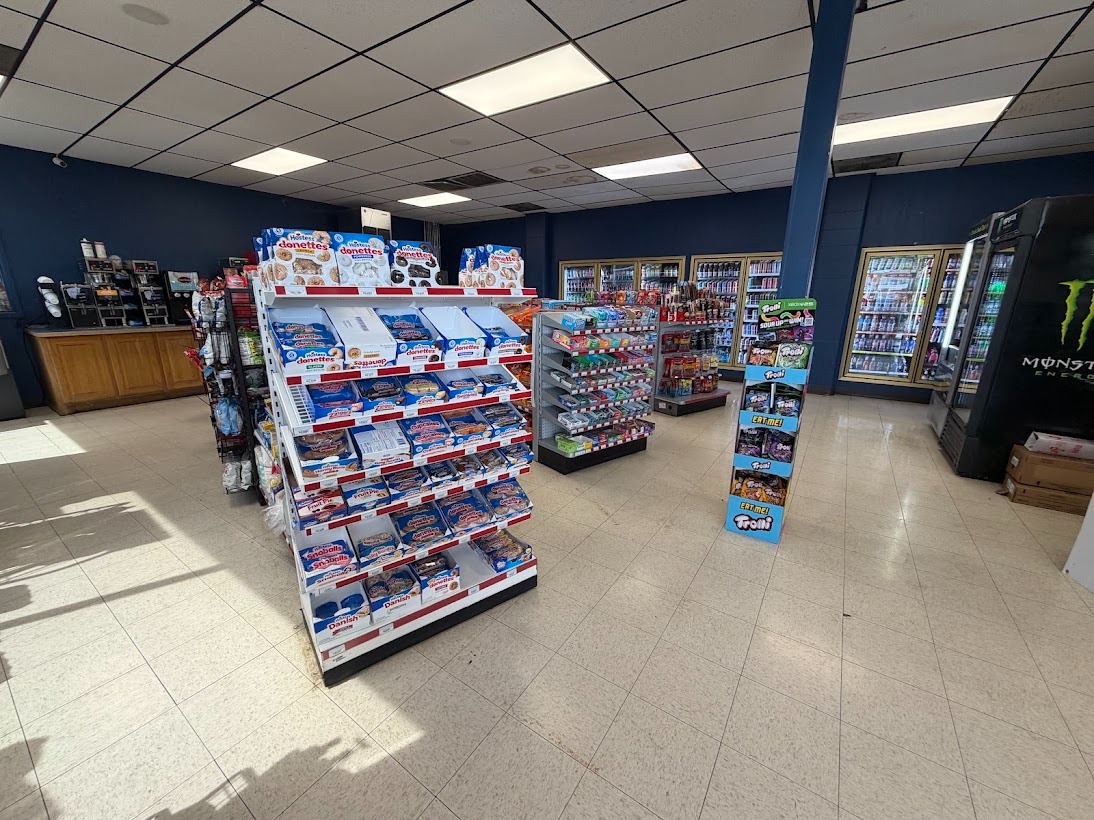 Snacks, candy, and grab-and-go aisle inside Campus Corner Minit Mart, Ada, OK. 