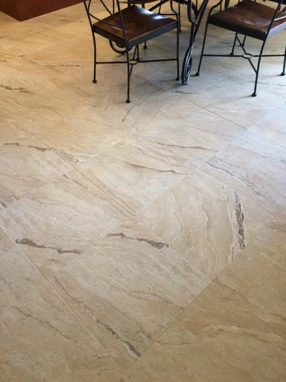 Completed wood-look tile flooring installation in a residential living space. 