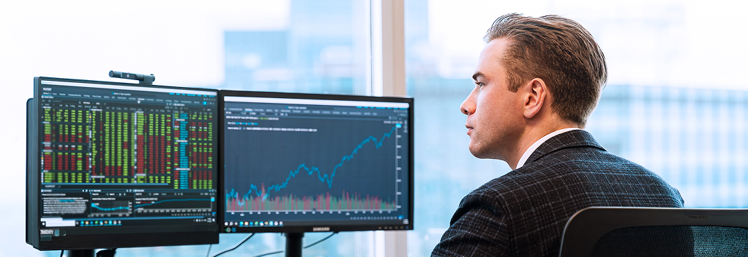 Manny Wood working on a computer in the Rae Family Wealth office.