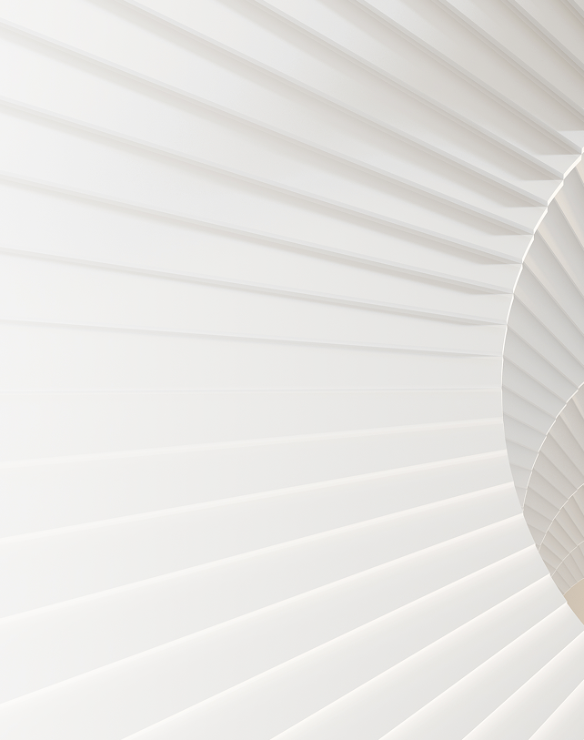 The view looking down on a white spiral staircase.