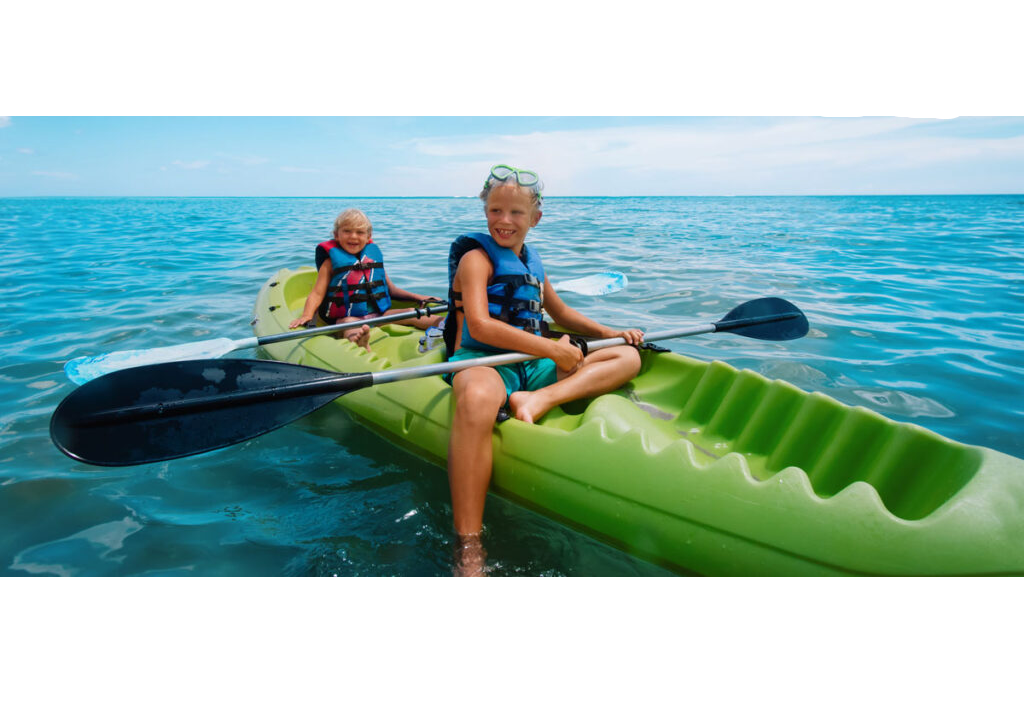 Kids exploring the Outer Banks' waterways in a double kayak rental.