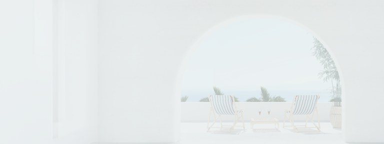 A serene view of an inviting patio with two beach chairs and a view of the sea.