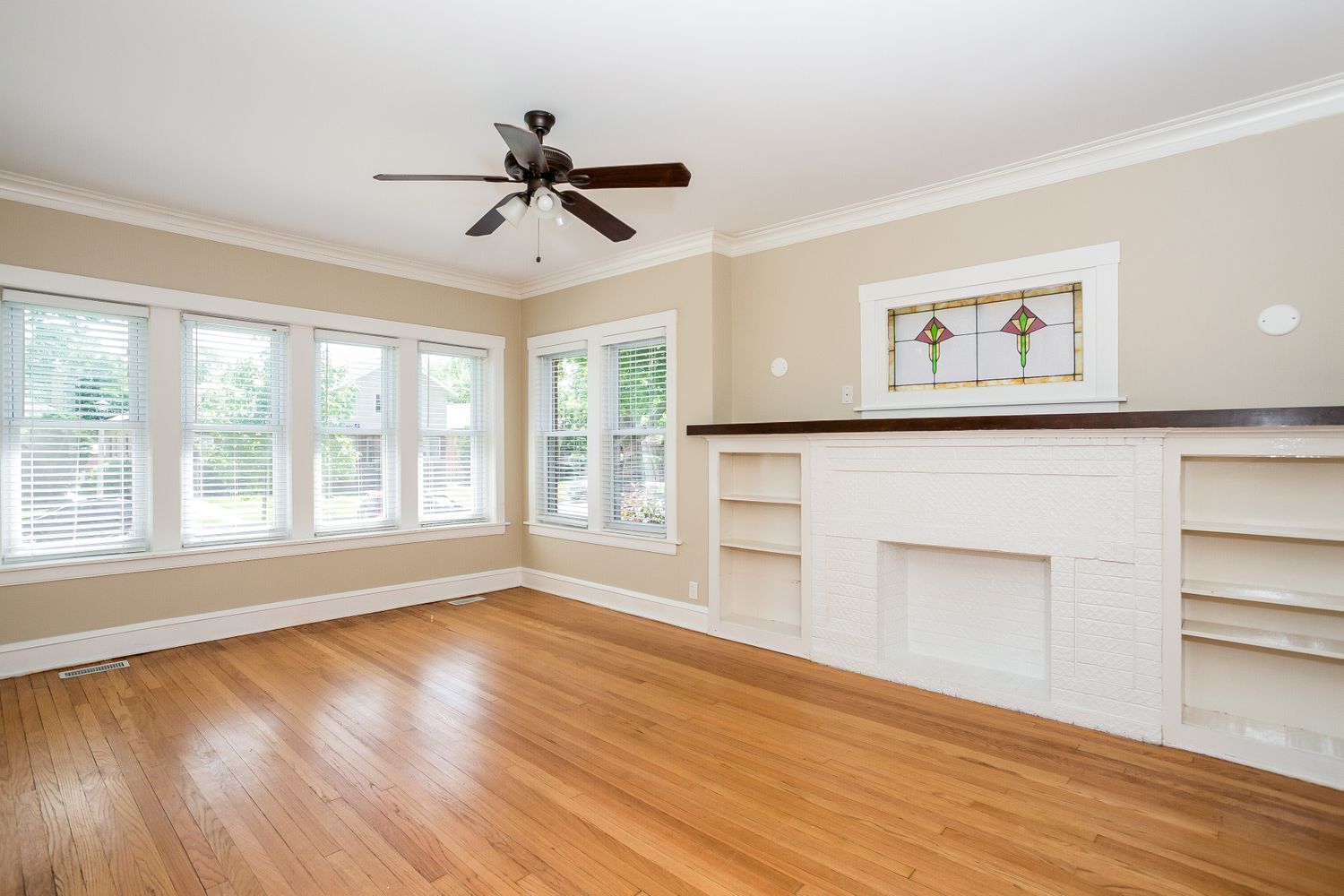 Gorgeous living space with hardwood flooring at Invitation Homes Chicago.