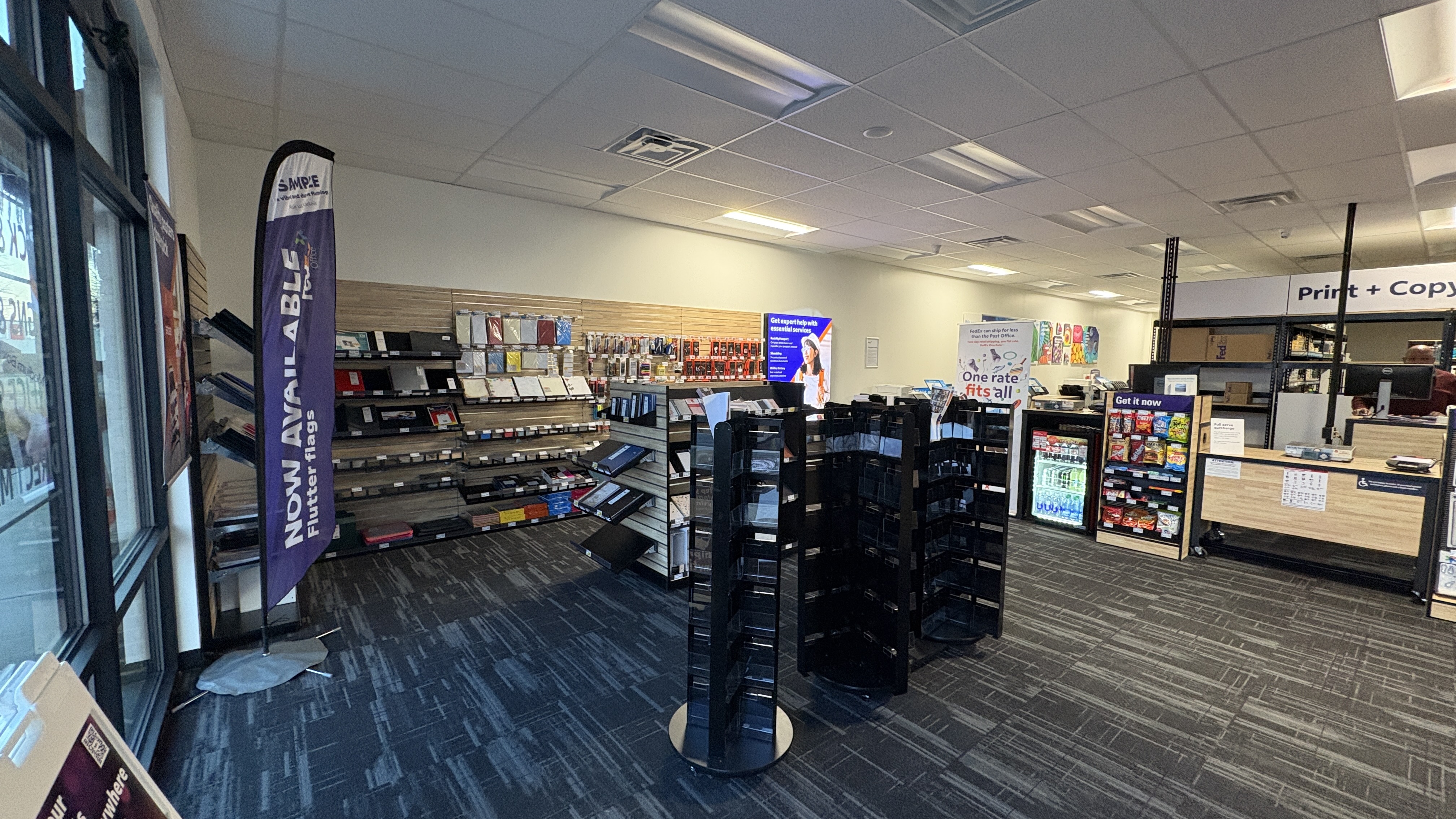 Office Supplies & Printing Services in Columbia: A view of our retail section and Print + Copy center. We offer a variety of office supplies, tech accessories, and professional printing solutions.