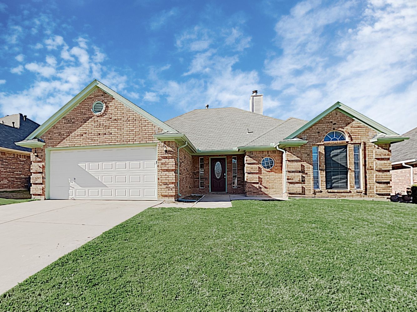 Charming home with a two-car garage at Invitation Homes Houston.