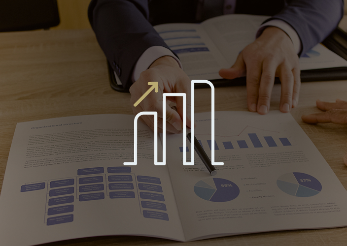 Close-up of an advisor reviewing documents with a client.