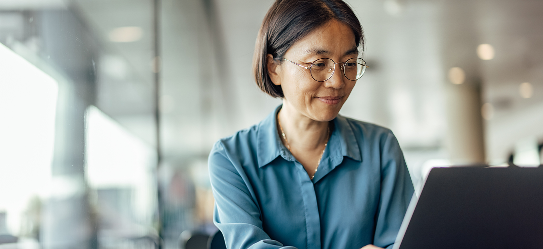 A client accessing her account information on her laptop.