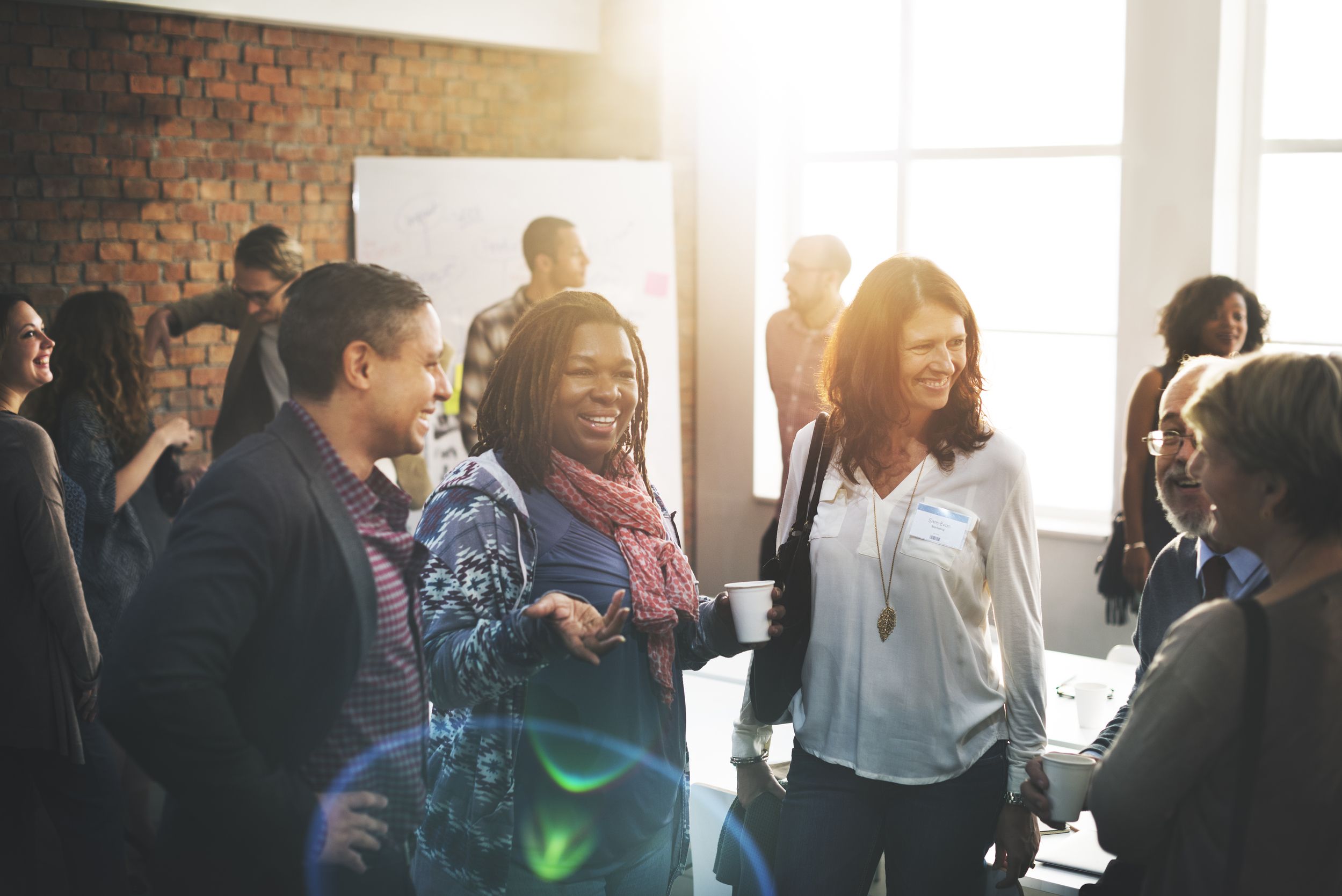 Adults gathering for church fellowship and conversation