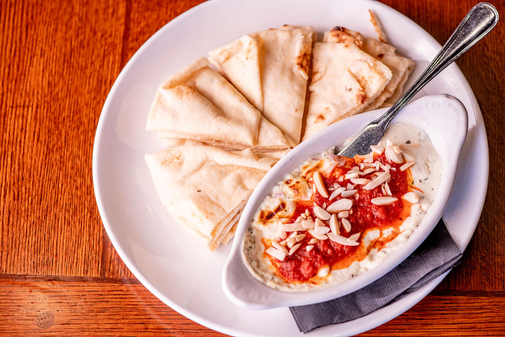creamy goat cheese, served with naan bread, choice of marinara & almonds or bacon onion jam topping
