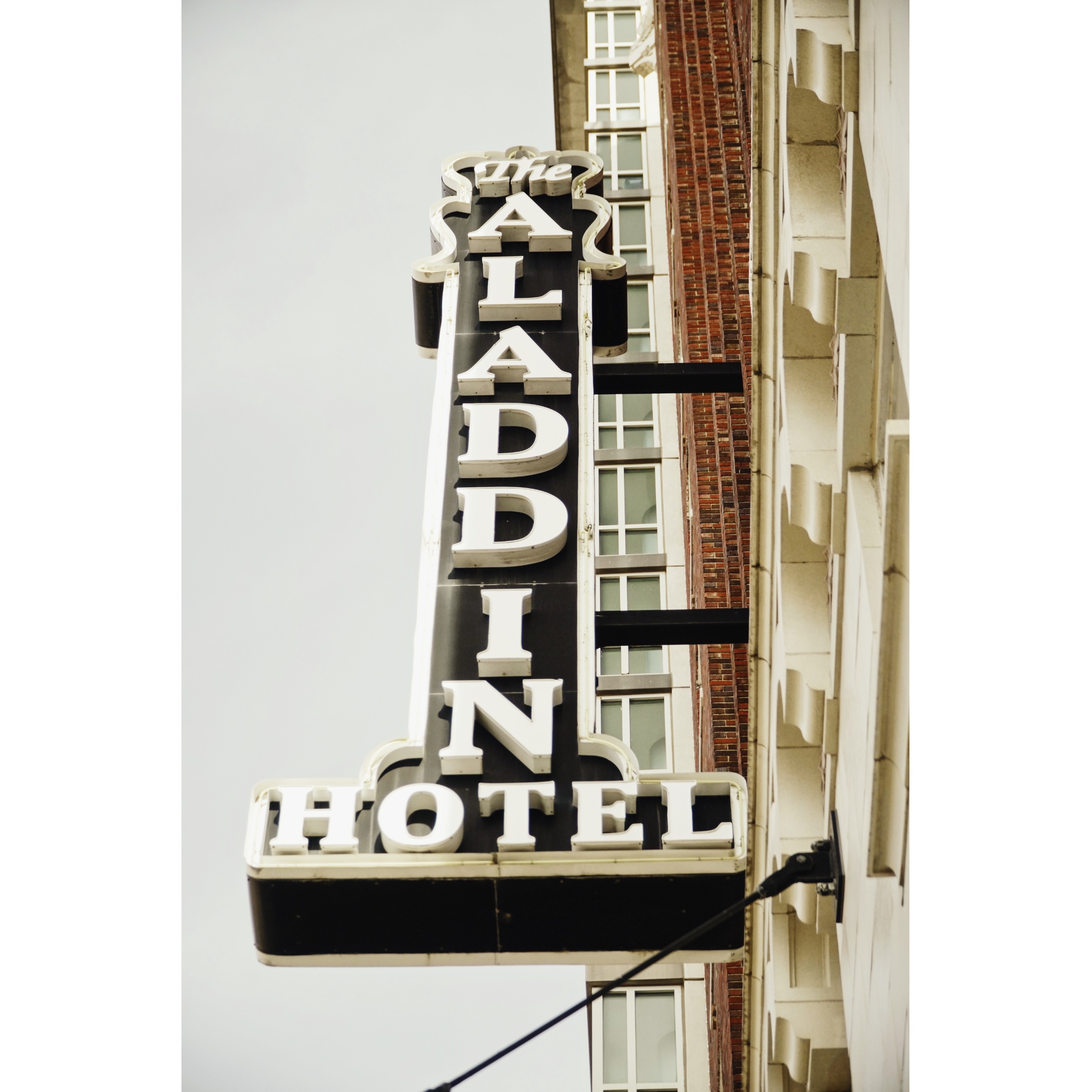 Historic hotel building signage highlighting adaptive reuse and historic redevelopment projects in Kansas City by Molzer Development.
