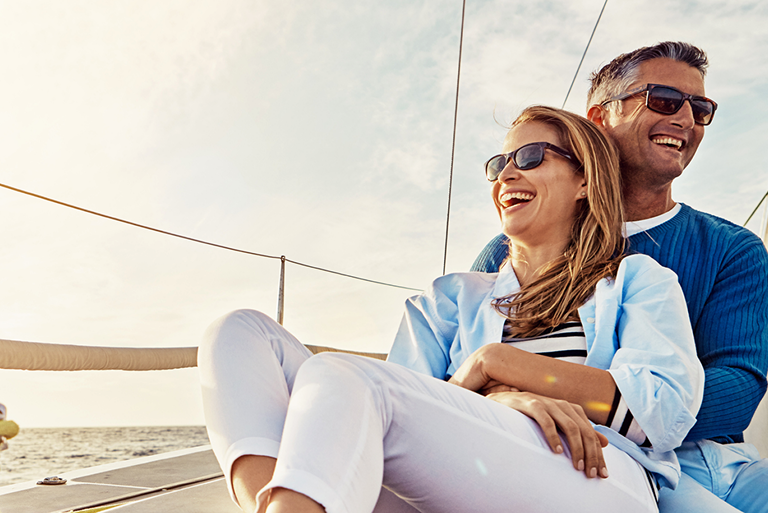 A couple laughing on a boat.