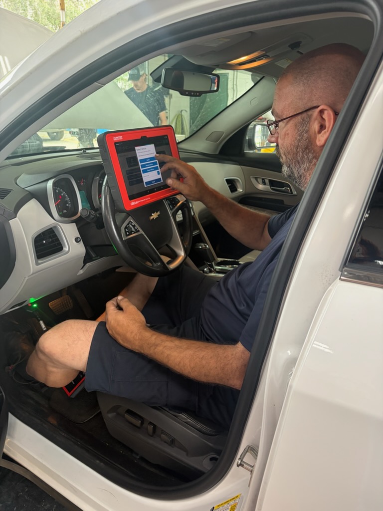 Engine diagnostics being performed at Walker Tire Point S, 4221 S. 48th Street in Lincoln, Nebraska.