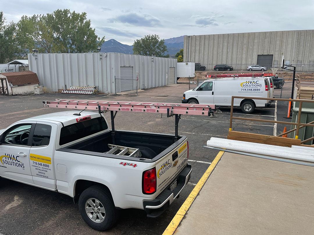 HVAC Solutions Truck Waiting To Load An Air Conditioner and Furnace