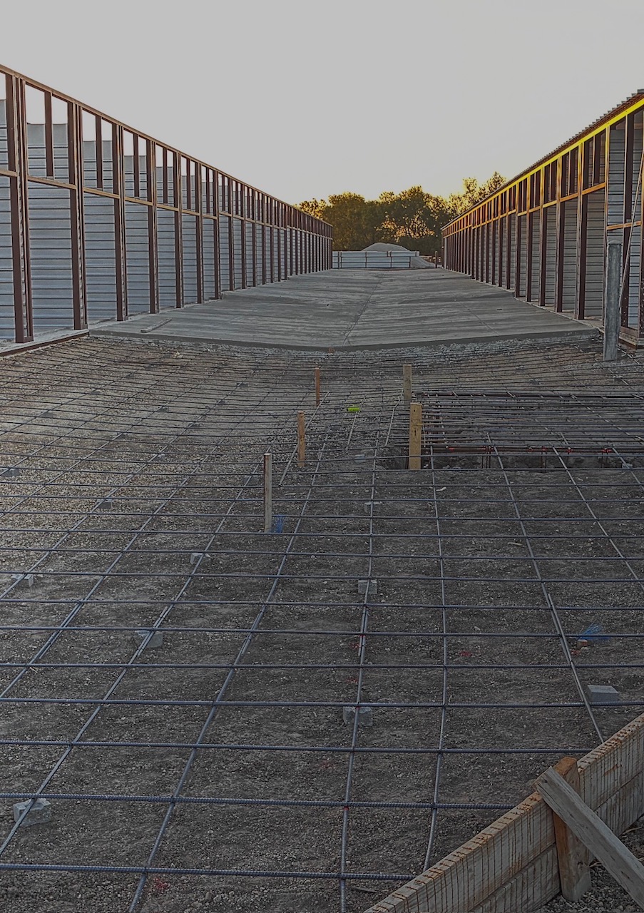 Engineered commercial development featuring reinforced concrete preparation and structural site impr 