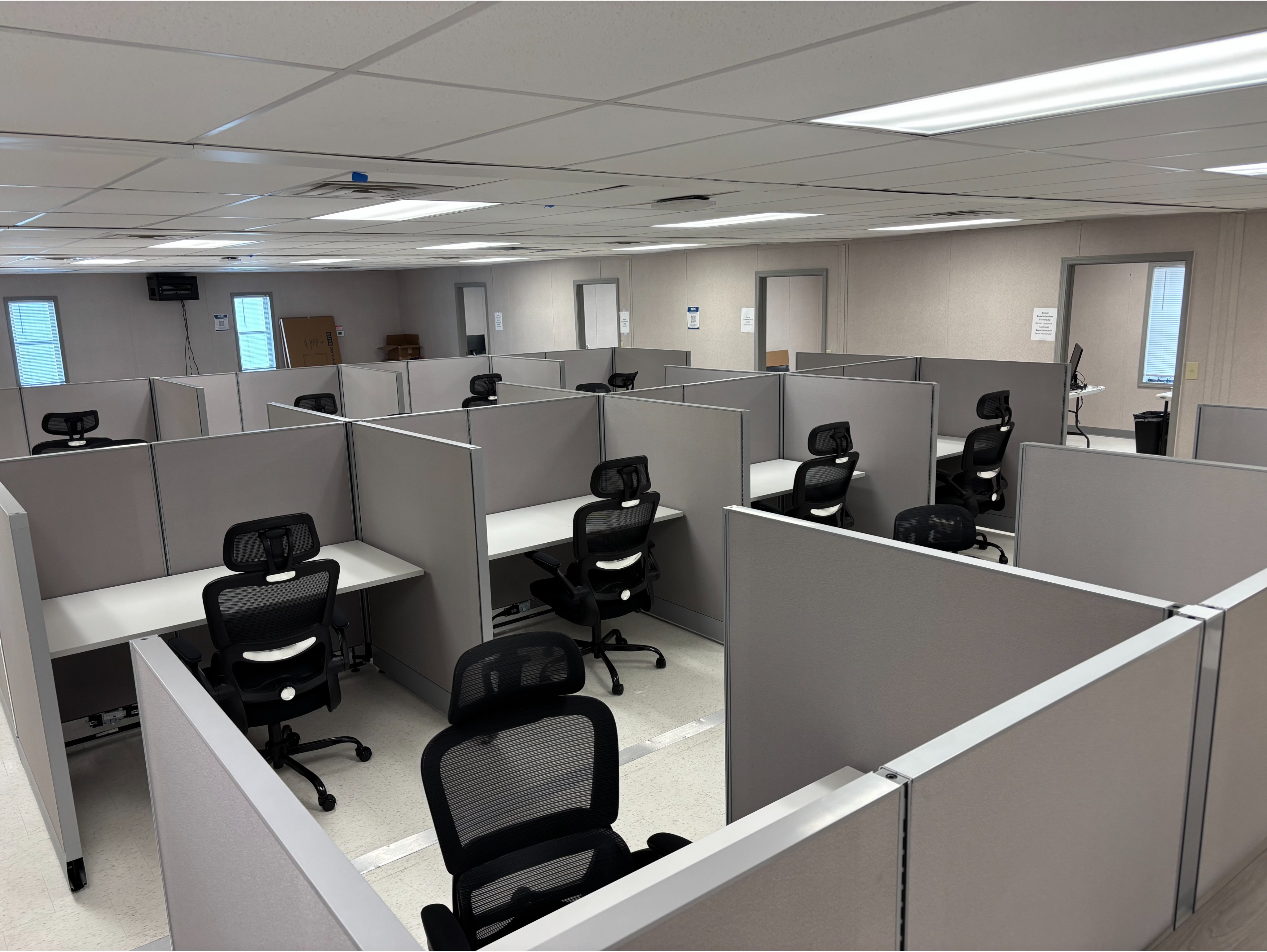 Call Center Workstation Cluster:

4-person star / cluster cubicle configuration with sound-dampening fabric panels and compact work surfaces.