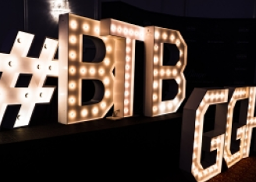 A BTB sign with lights.