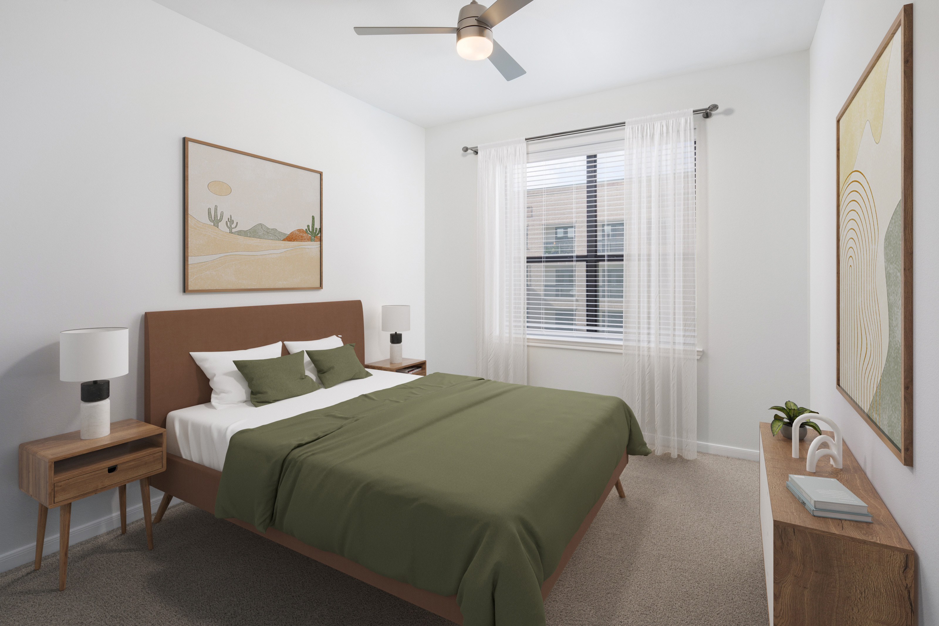 Modern finish bedroom with ceiling fan and plush carpet at Camden Travis Street Apartments in Midtown Houston, Tx