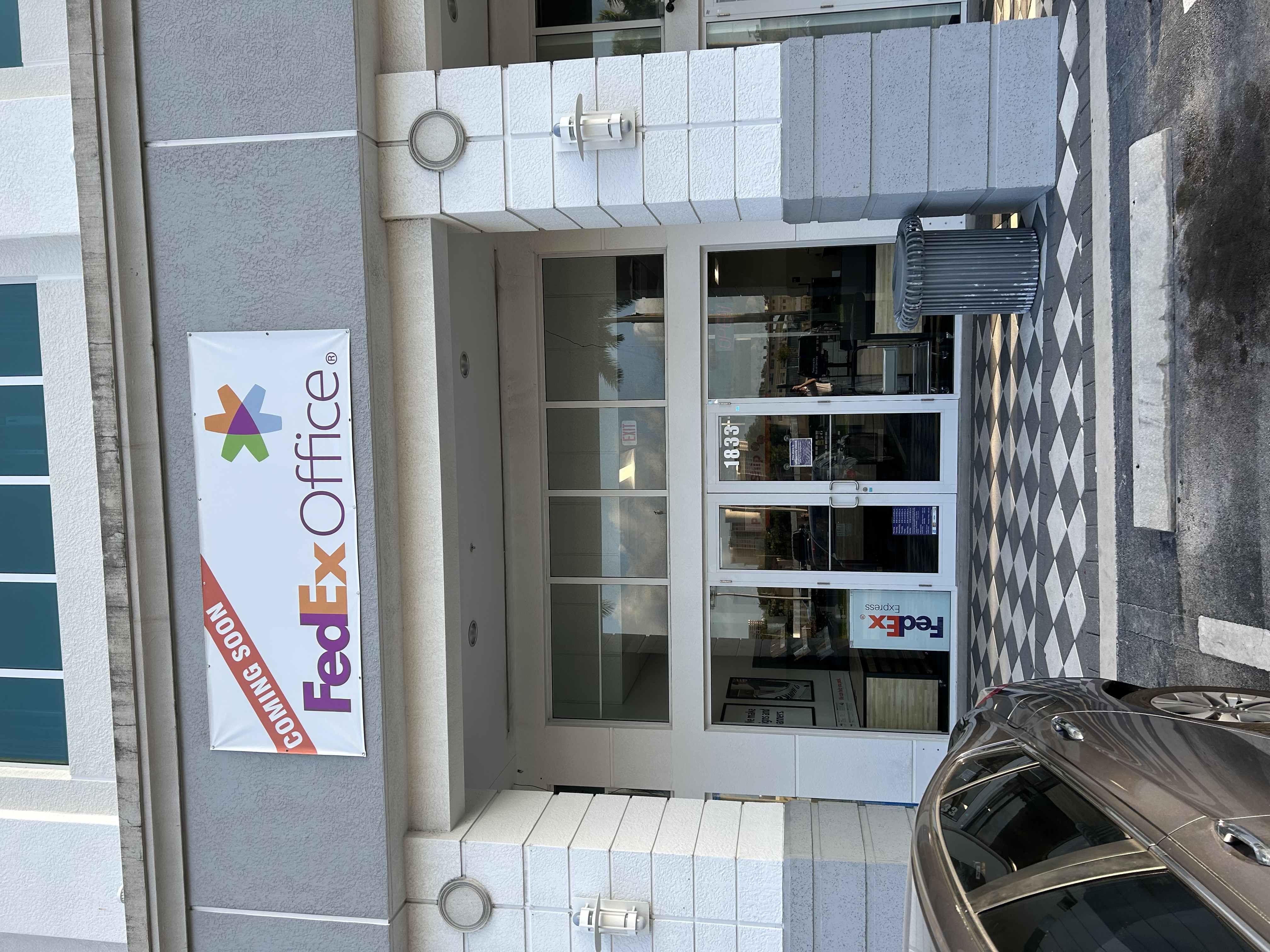 FedEx Office Print and Ship Center now open in North Miami Florida with storefront signage and customer parking access.