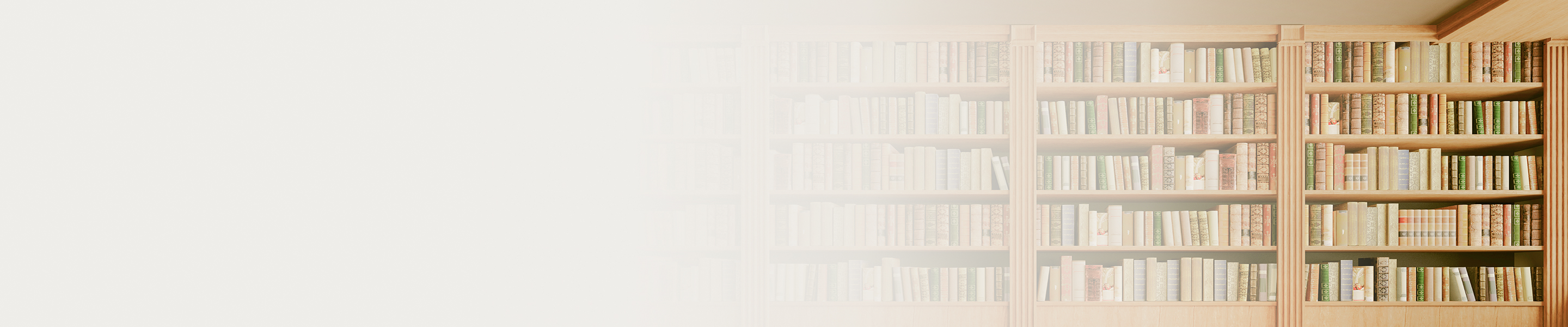 A beige, wooden bookshelf full of books.