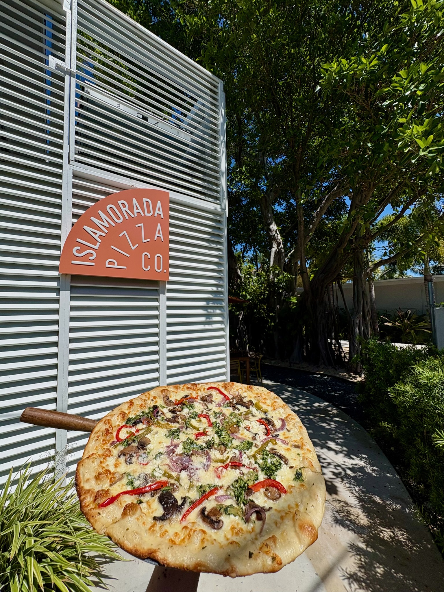 Garden Pizza White Sauce, Mozzarella, Bell Pepper, Red Onion, Spinach, Artichoke, Mushroom, Feta, Basil Pesto