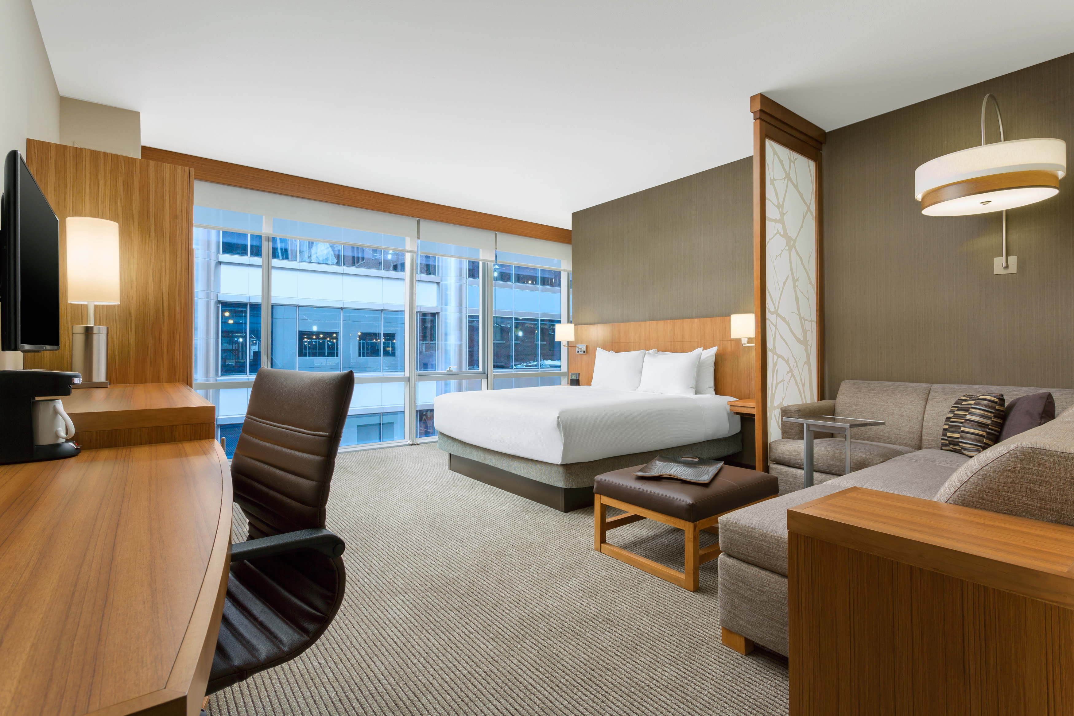 The specialty king suite is extra spacious offering 100 additional sq. f.t of space and features a separate sleeping and living area, with mini-refrigerator, single serve coffee maker, free Wi-Fi, a Cozy Corner with sofa sleeper, and bathroom with double vanity sinks.