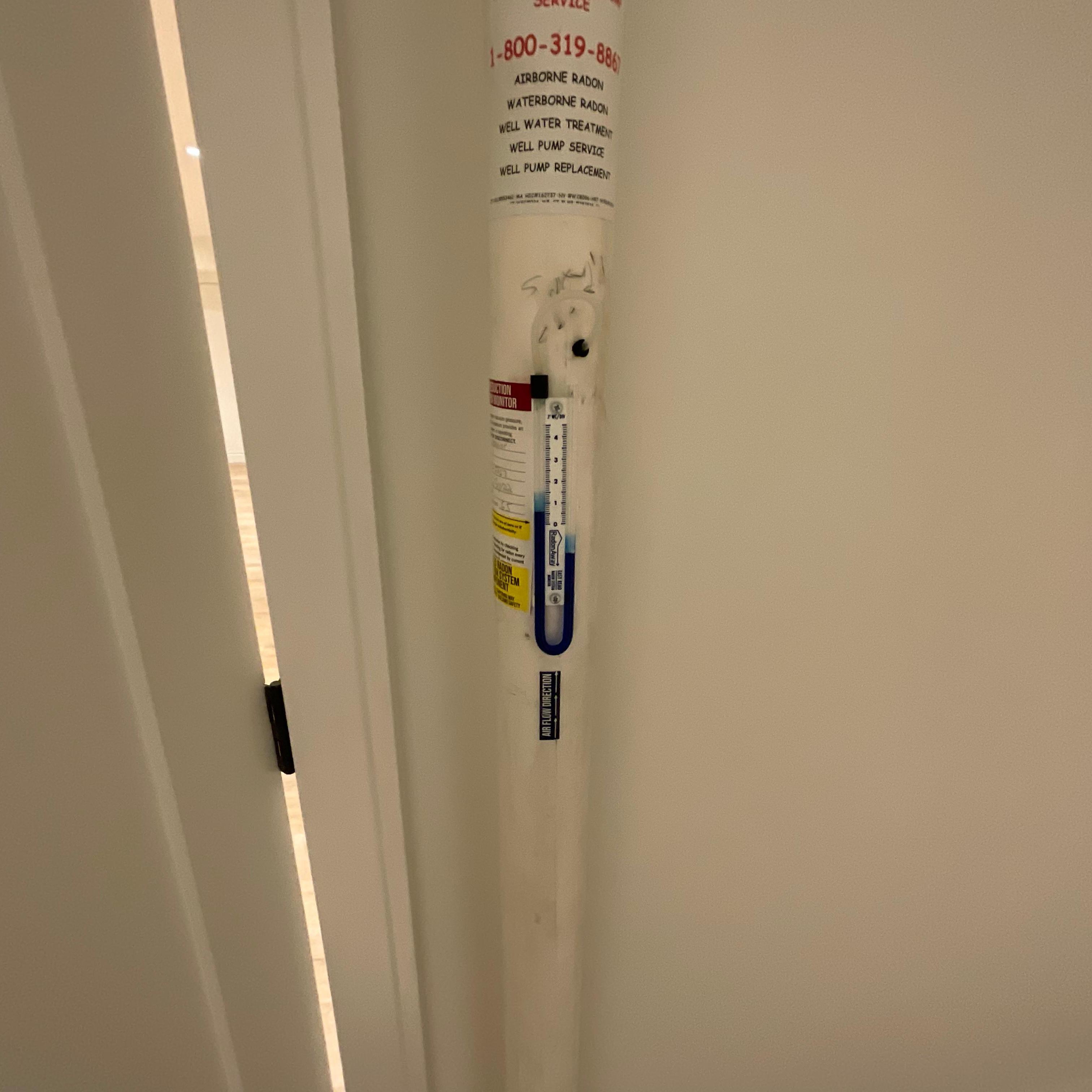 Manometer of a Radon Mitigation System working correctly (Reverse "J").