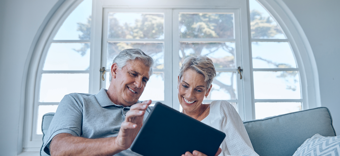 Clients reviewing the financial literacy course on their tablet.