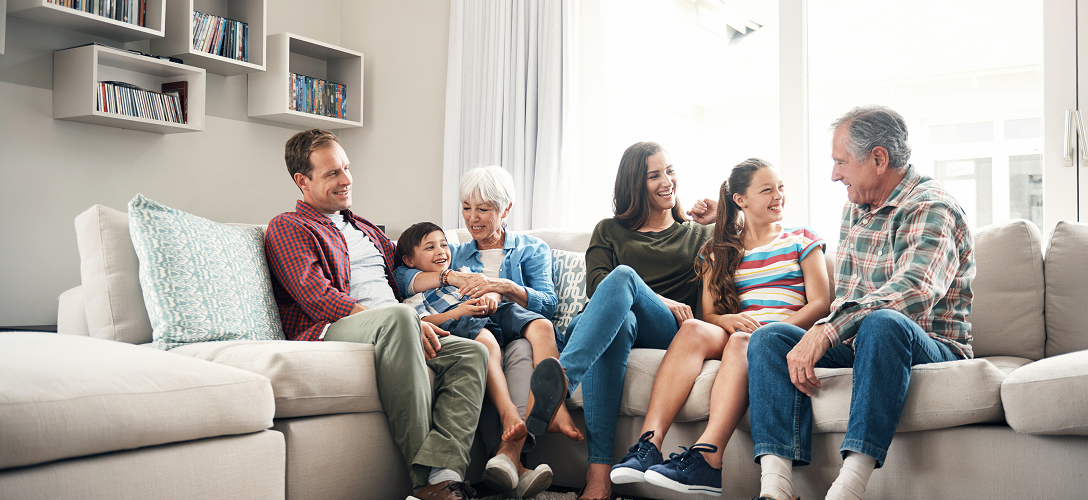 A multigenerational family on a couch.