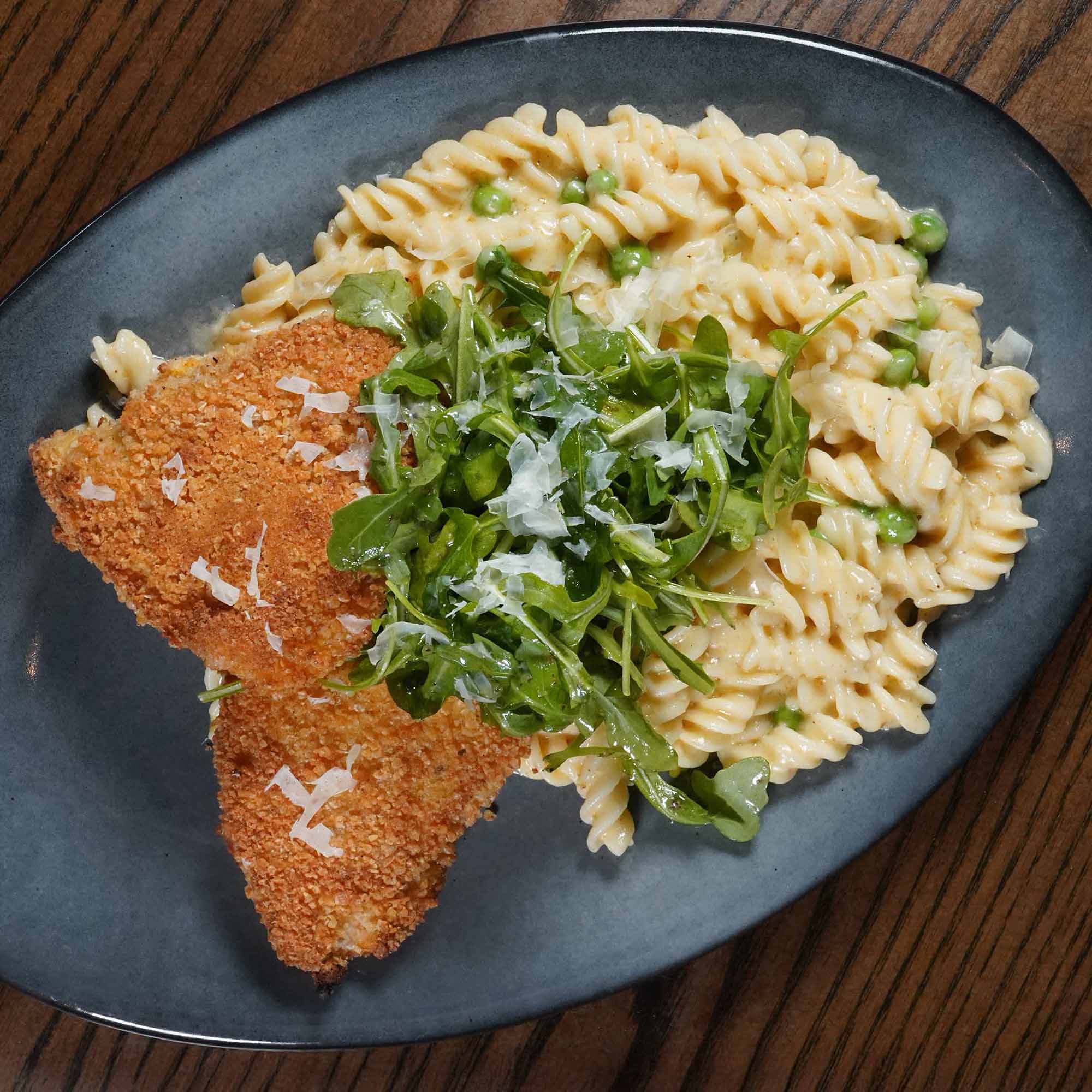 Panko-crusted chicken, rotini, english peas, parmesan cream sauce, arugula, shaved parmesan.