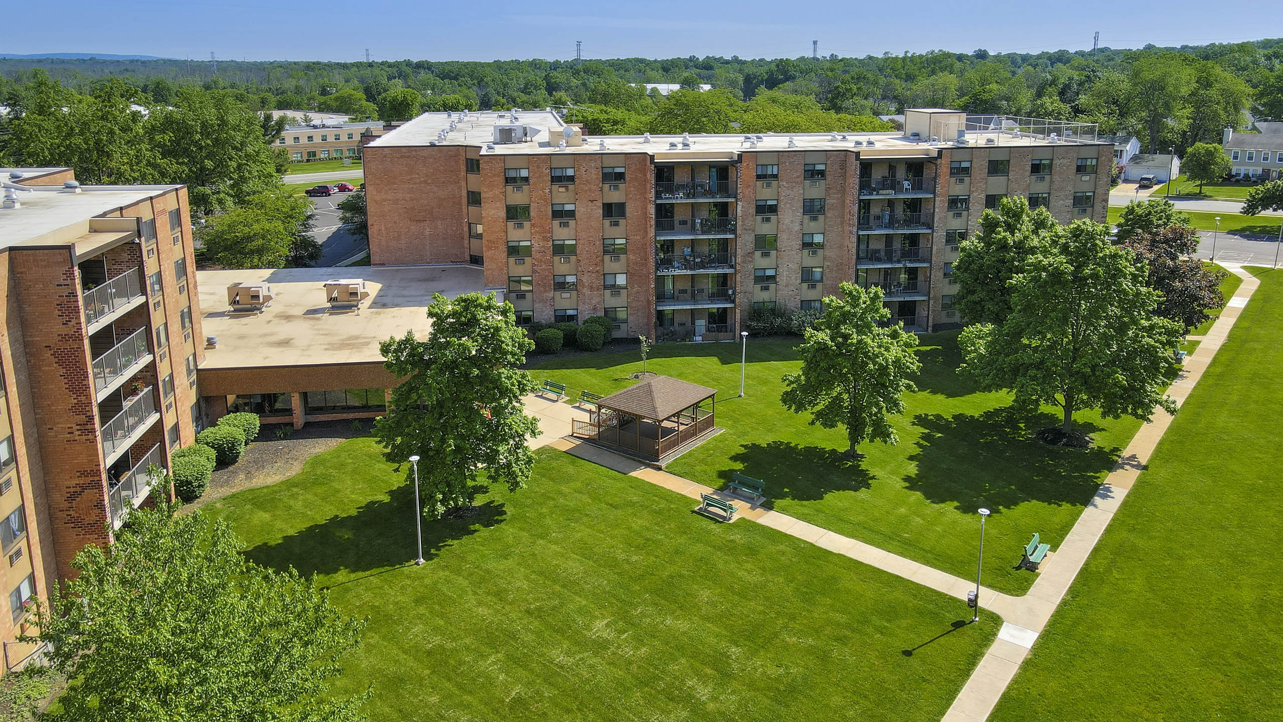 A large grassy area in front of a building.