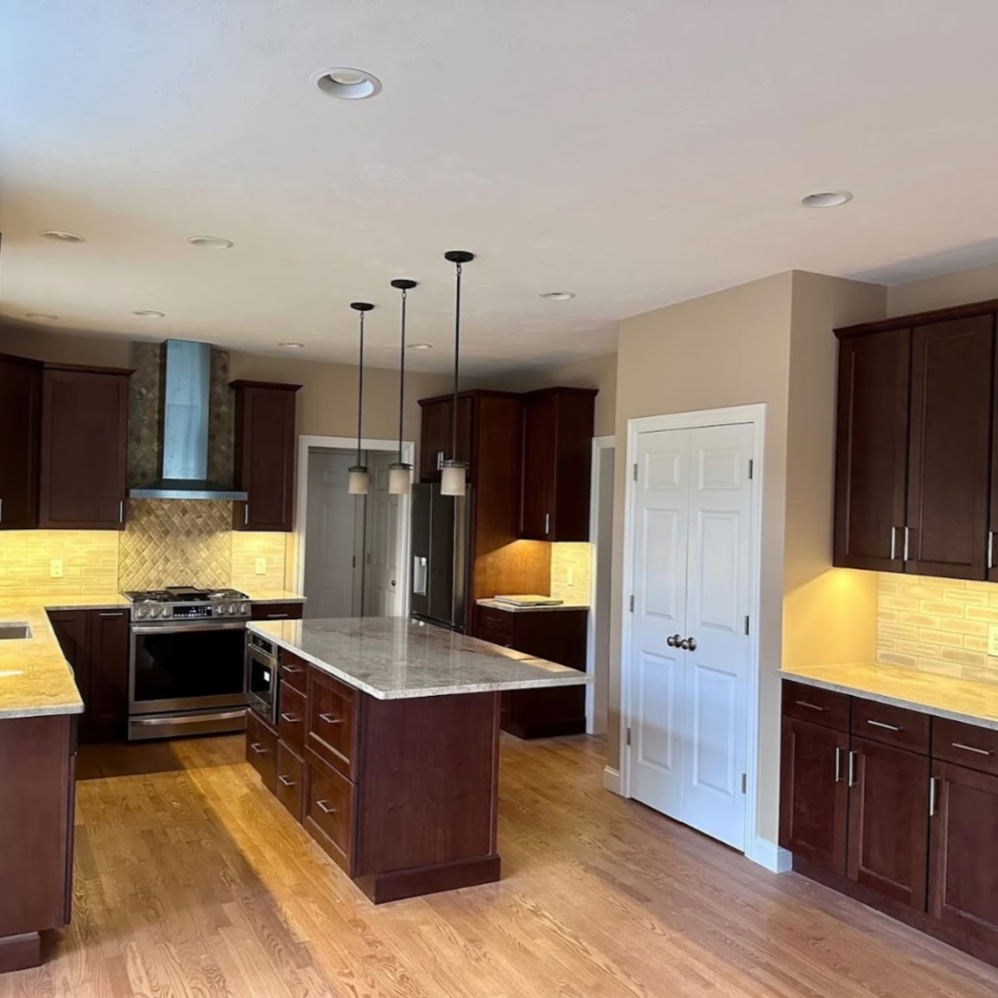 Modern open-concept kitchen featuring a spacious island, sleek cabinetry, and high-end finishes. Designed for both style and functionality, perfect for contemporary homes.