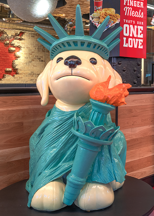 Raising Cane's Dog at the entrance of C888 in NYC