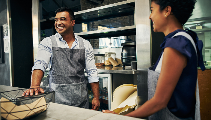 Business owners sharing a laugh.