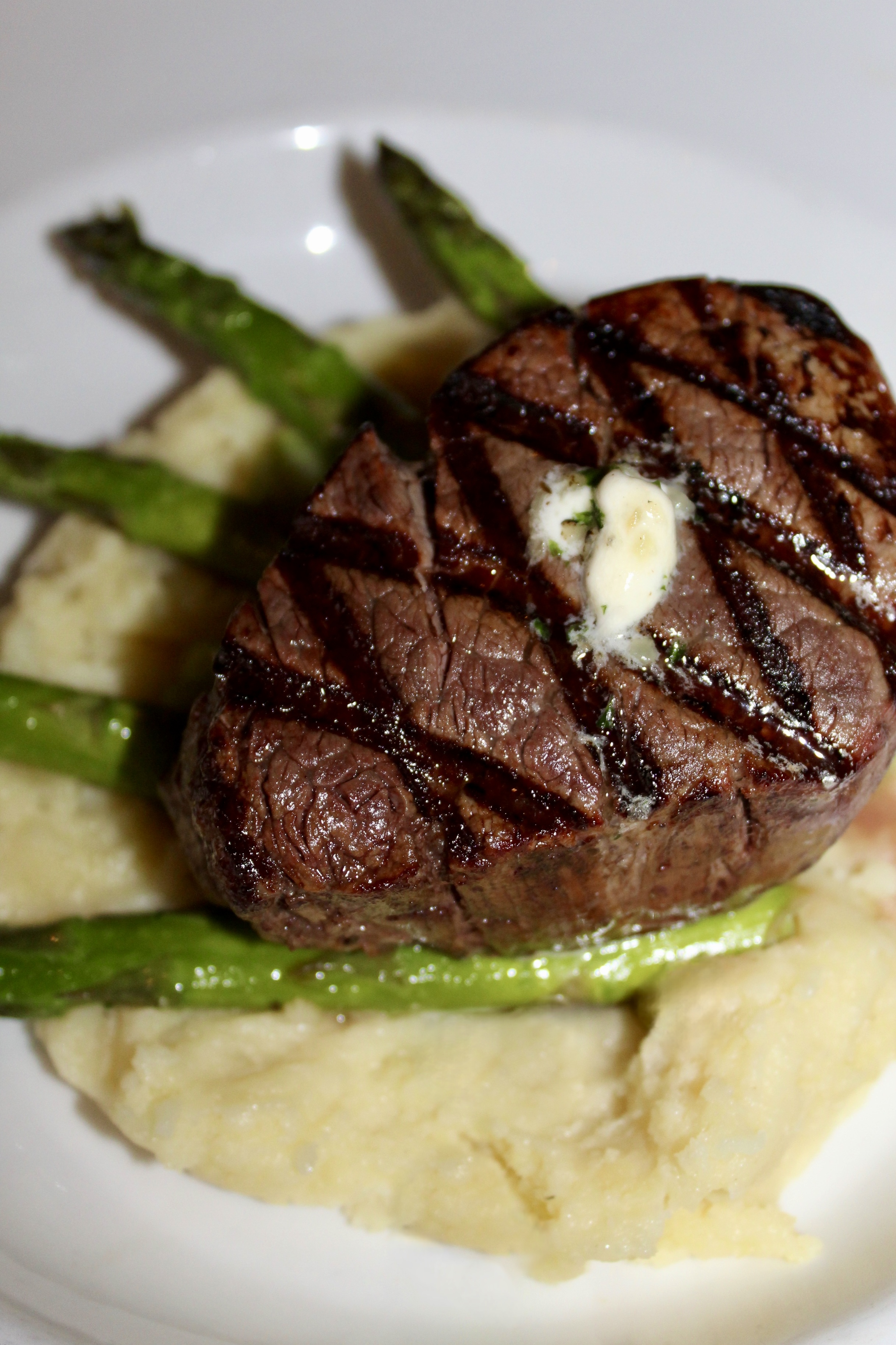 Filet Mignon over whipped potatoes and asparagus 