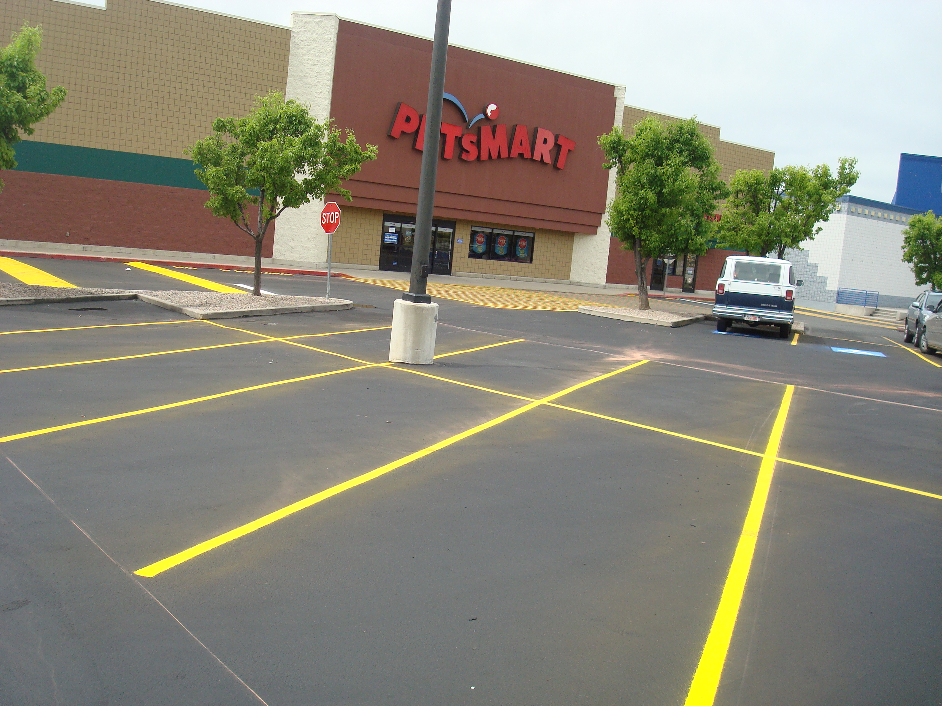 Commercial parking lot striping with yellow lines completed by Eckles Paving in Cache Valley Utah