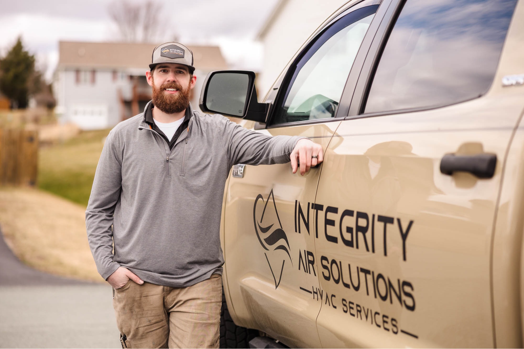 Lucas beside his Integrity Air Solutions Service Truck