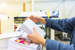 Employee works through stack of files