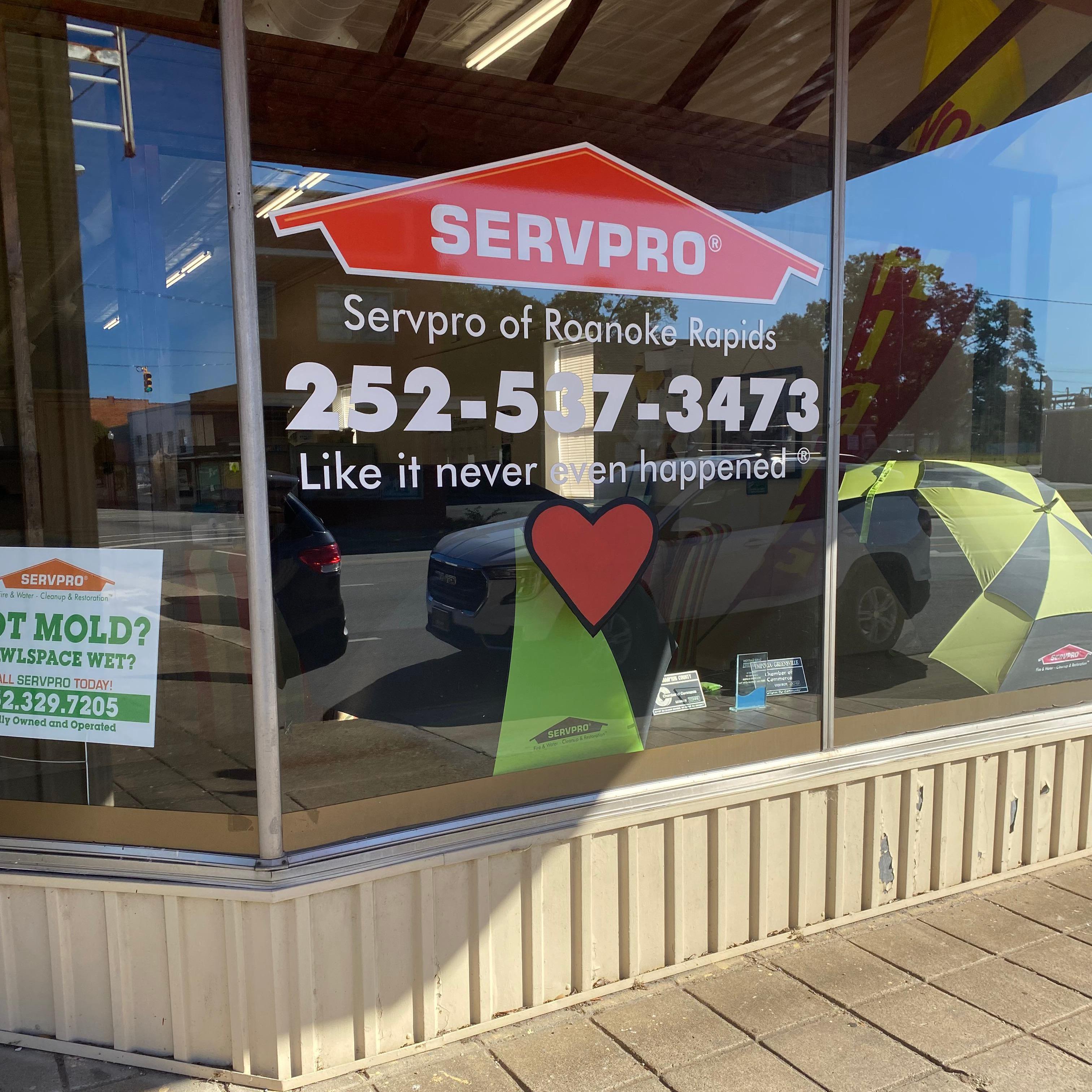 The front of our office, along with the SERVPRO house logo and our phone number.