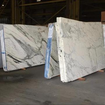 A glimpse at our exquisite collection of Italian Carrara and Calacatta Marble Slabs.