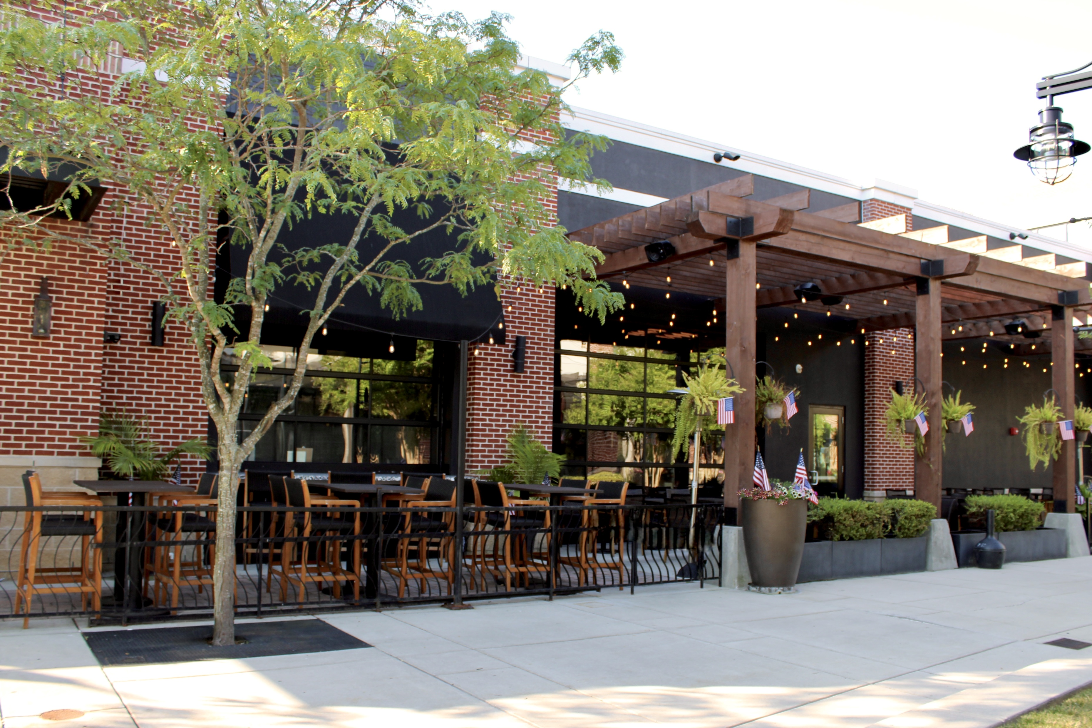 Mama's On The Half Shell Owings Mills Outdoor Dining Area dressed in American flags for Fourth of Ju 