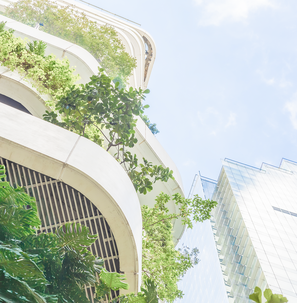 Modern, curved building lined with greenery on every level.