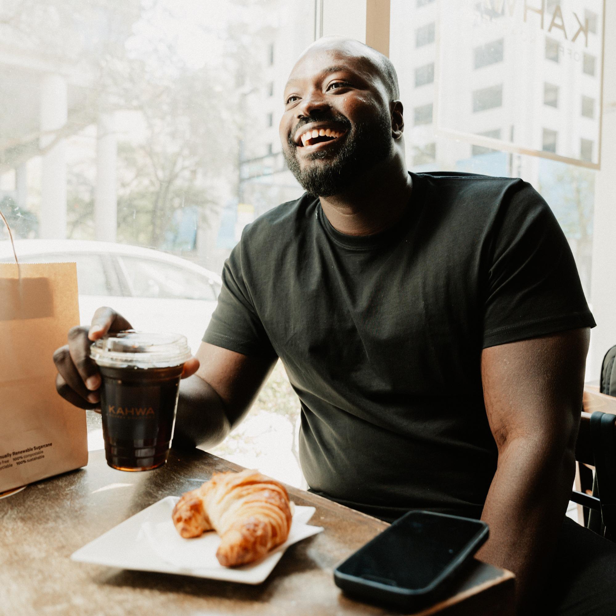 Man with Kahwa Coffee and food smiling