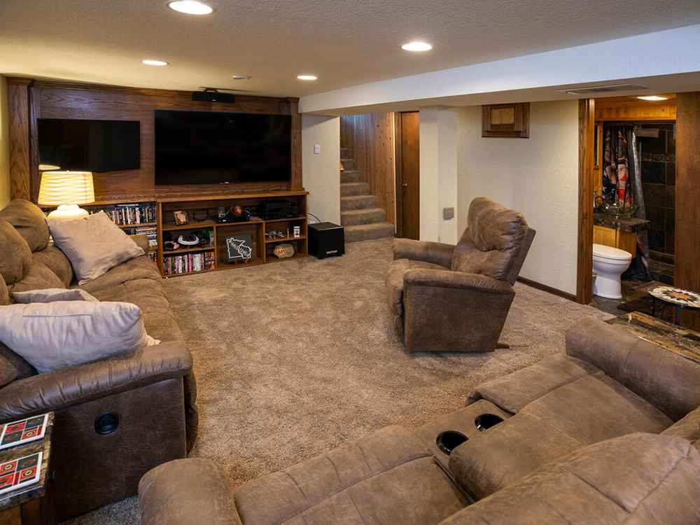 ZimmTown Construction’s living room remodel creates a warm, inviting space with modern finishes and thoughtful design. Stylish flooring, custom trim, and upgraded lighting enhance the ambiance, while an open, functional layout makes it perfect for relaxing and entertaining.