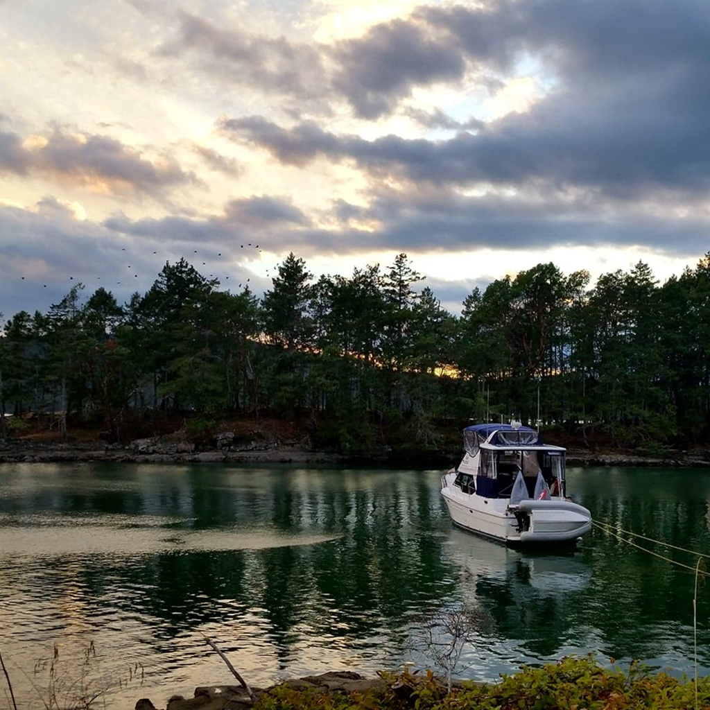 A boat anchored in calm water.